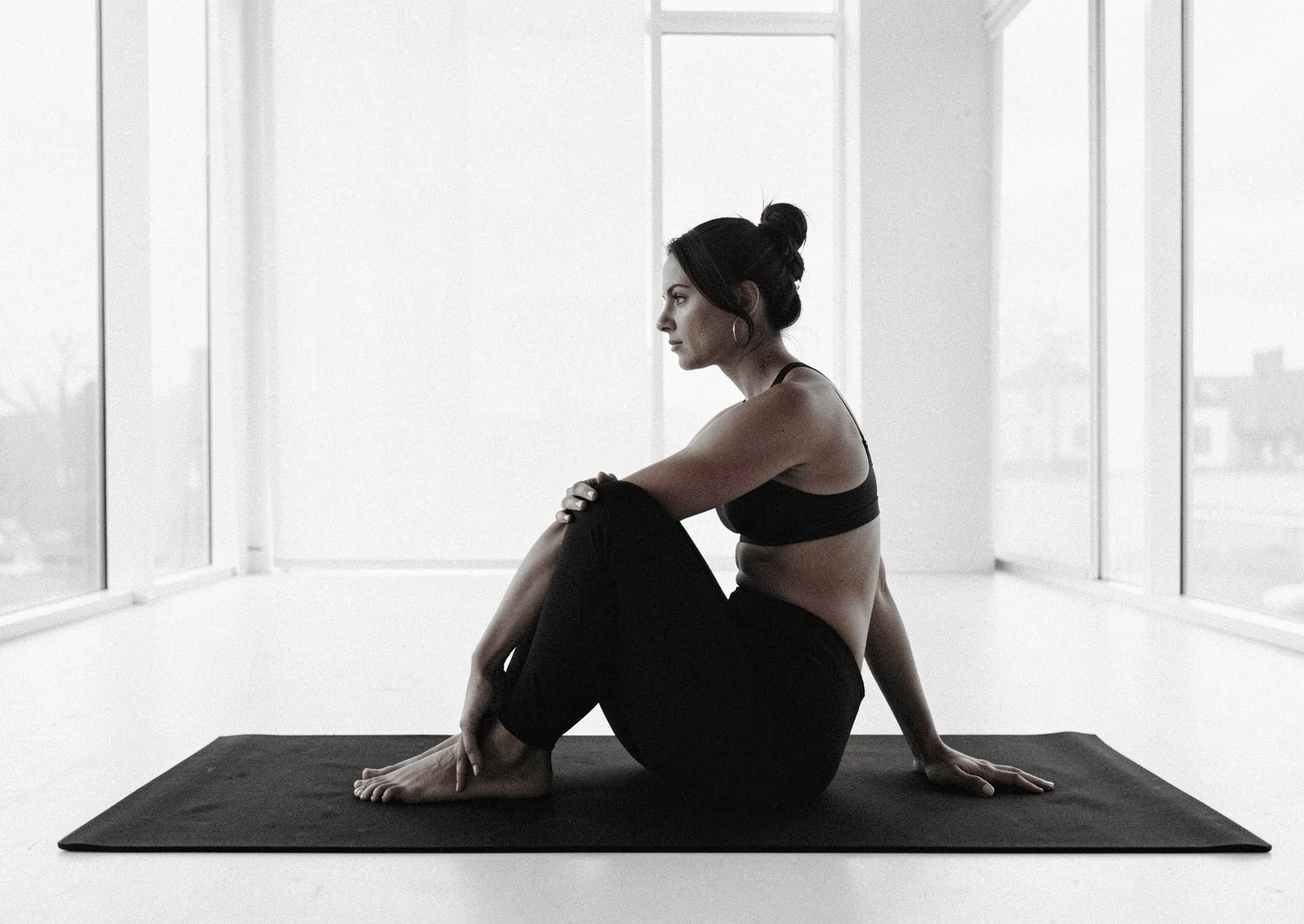 Grounded yoga movement in a modern studio